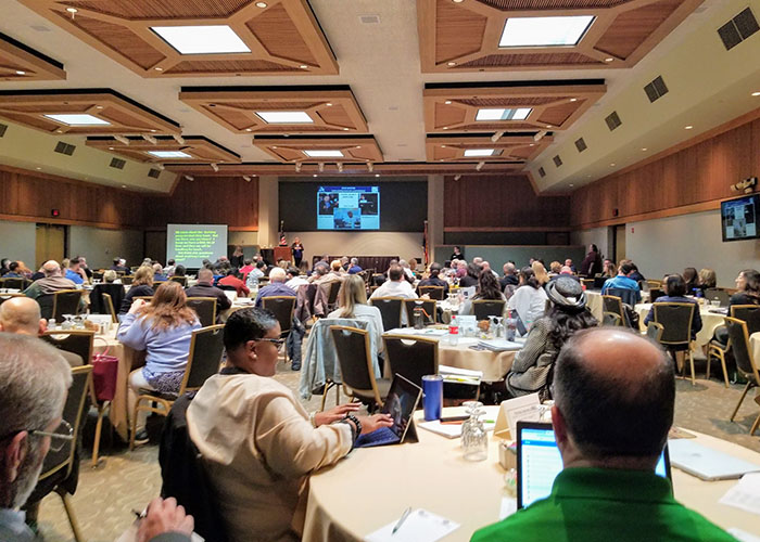 Dr. Nanette Odell leading a presentation at an ADA conference
