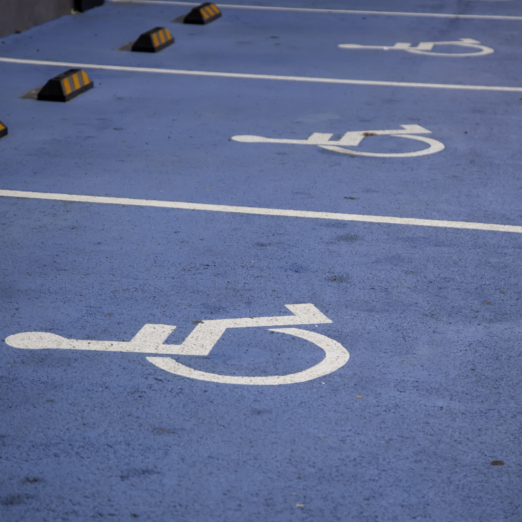 Parking spaces displaying the International Symbol of Accessibility.